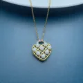 Elegant gold-tone heart pendant necklace featuring faux pearls and rhinestones details. - Pearl B