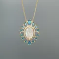 Close-up detail view of the exquisite gold-plated Guadalupe mother-of-pearl pendant necklace. - Style B Guadalupe
