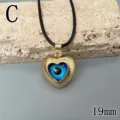 Evil eye heart necklace for women, gold plated blue eye pendant with black cord chain. - Letter C