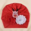 Red baby turban hat featuring cute Christmas reindeer and dual flower decorations. - One Size / Red with Glitter Reindeer