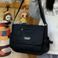 Black canvas messenger bag for women, casual crossbody shoulder bag with multi pockets. - No Pendant / Black