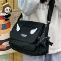 Sweet cool style canvas messenger bag for women, featuring cute angel wings and star charm. - Angel Wings & Star Pendant / Black