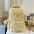 Zaino giallo carino con dolci fiocchi per la scuola, i viaggi e l'uso quotidiano casual. - Giallo con Ciondolo Stella