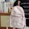 Pink polka dot backpack detail showing cute design, soft fabric, and convenient front elastic cord. - Pink