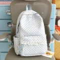 Light blue polka dot backpack with white lace ruffle, ideal for daily student school use. - Blue