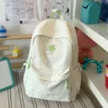 Beige backpack featuring light green four-leaf clover embroidery, cute casual campus bookbag. - No Pendant / L / White