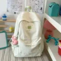 Casual light green canvas backpack with cute four leaf clover embroidery and lovely pendant. - With Charm / L / White