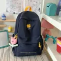 Navy blue school backpack with yellow clover embroidery and cute flower pendant. - With Charm / L / Dark Blue