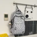 Retro street style star print canvas backpack with multiple compartments for students daily use. - Gray With Baseball Pendant