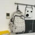 Retro street style star print canvas backpack with multiple compartments for students. - White With Baseball Pendant