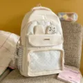 Cute milky yellow polka dot backpack with bunny ears and clear front pocket design. - Backpack And Plush Pendant / White