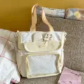 Milky yellow canvas tote bag with bunny ears and clear front pocket for daily use and school. - Shoulder Bag with Pendant / Yellow