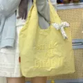 Casual κίτρινη τσάντα tote από καμβά με κέντημα και χαριτωμένο φιόγκο, ελαφριά. - Με Μπρελόκ / Κίτρινο