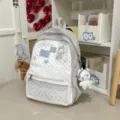 Sac à dos Ita à pois gris avec poche avant transparente et joli pendentif en peluche. - S / Avec Charme / Blanc