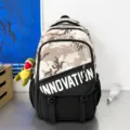 Sac à dos camouflage color-block élégant avec pendentif dinosaure pour l'école et les voyages - Kaki Avec Dinosaure