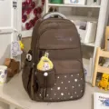 Brown school backpack with star pattern, cute pendant and large capacity for girls. - With Charm / Brown