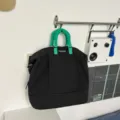 Borsa da viaggio nera con manici verdi, variante borsone sportivo fitness espandibile. - Nero