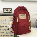 Red multi-compartment canvas backpack with cute duck pendant for students and travel. - Black Leg Duck Pendant / L / Red