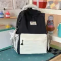 Casual black and off-white colorblock backpack with cute handle print for daily school and travel. - Large (With Charm) / Black