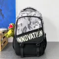 Grey camo backpack variant with Innovation print and dinosaur pendant, stylish school bag. - Black and Grey Camouflage with Dinosaur