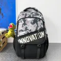 Trendy camo colorblocked utility backpack for high school students, large capacity book bag. - Black and Green Camouflage with Dinosaur