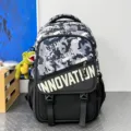 Camouflage school backpack, grey black tactical bookbag with dinosaur pendant for teens and students. - Black and Blue Camouflage with Dinosaur