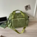 Green polka dot travel duffel bag, large capacity commuter shoulder bag with adjustable strap. - Green