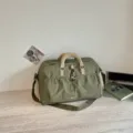 Green travel duffel bag with khaki handles, casual multifunctional gym bag and waterproof design. - Green