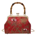 Detailed view of the vintage Chinese style red panda bamboo pattern kiss-lock handbag. - Wine Red Bamboo Handle