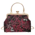 Details of Chinese vintage kiss-lock bag featuring intricate red bamboo and panda woven fabric. - Black Metal Handle