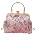 Close-up detail of the vintage Chinese style kiss-lock bag featuring pink bamboo and panda pattern fabric. - Pink Metal Handle