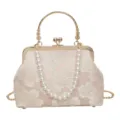 Vintage floral embroidered kiss lock handbag with pearl handle and metal frame for women. - Golden Handle / Pink