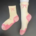 Detailed view of women's merino wool thick warm mid-tube socks with cute pink bow and color block - 36-42 / Off-White Pink Bow