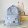 Light blue canvas student backpack with alphabet patches, large capacity school bag for daily use. - Blue