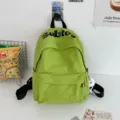 Zaino scolastico verde in tela per ragazze, grande zaino casual con ciondolo peluche. - Verde con palla a gamba lunga