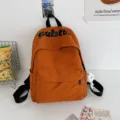 Zaino scolastico casual stile giapponese per donna, grande borsa in nylon resistente. - Arancione + Palla di Peluche