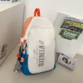 Multi-functional color block backpack student school bag with spacious capacity and chic design. - Blue + Twist Pendant