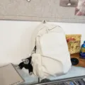 Minimalist white casual backpack large capacity fashion school bag for students daily use. - White + Chimpanzee