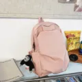 Minimalist large-capacity pink canvas backpack for daily casual use and school students. - Pink + Chimpanzee