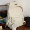 Casual beige canvas school backpack for teen girls, stylish daily daypack with charm. - Hat Elf Pendant / Off White