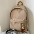 Casual beige canvas backpack for students, stylish daily school bag with cute plush pendant. - Hat Elf Pendant / Khaki