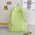 Casual light green student backpack with front pocket and braided zipper pulls for daily use. - Green Large