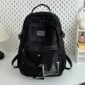 Utility style black school backpack with multiple pockets and a clear front window. - Black