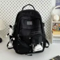 Casual utility backpack for students, large capacity bookbag with multi pockets and cute doll. - Black + Plaid Rabbit Pendant