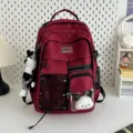 Red utility style large capacity student school backpack with cute plush doll pendant. - Red + Plaid Rabbit Pendant