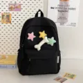Black student backpack variant featuring cute plush star and bone charms for casual daily use. - Black Large + Star + Bone