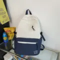 Color-block canvas backpack in cream and navy, minimalist student school bag with multi pockets. - Blue