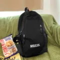 Black school backpack large capacity casual daypack for teens students daily travel bag - Soot Sprite Pendant / Black