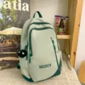 Large capacity middle school student backpack stylish green school bag with cute pendant - Soot Sprite Pendant / Green