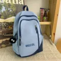 Casual light blue school backpack with large capacity, multi compartments and cute plush pendant. - Soot Sprite Pendant / Blue